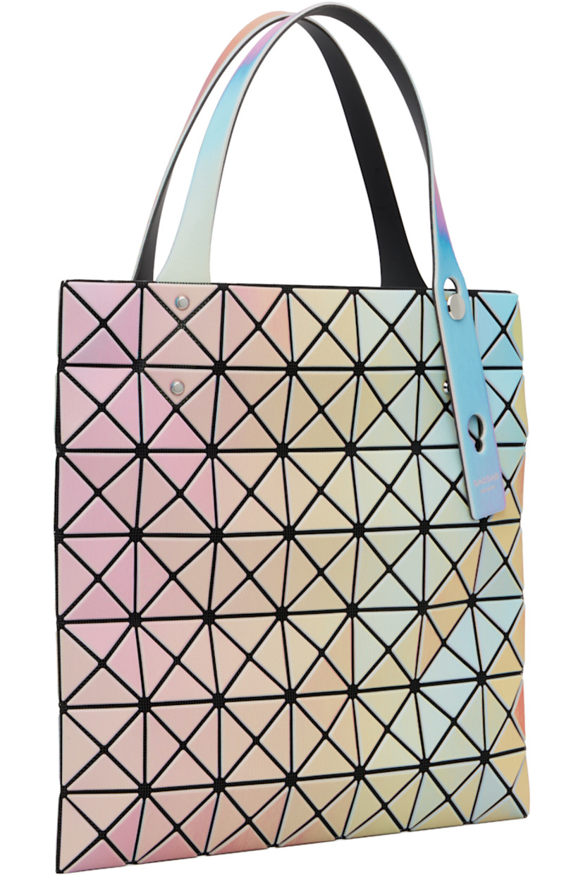 Mesh tote.

· Triangular iridescent vinyl appliqués throughout
· Adjustable shoulder straps
· Zip pocket at interior
· H11" x W11"

Supplier color: White base