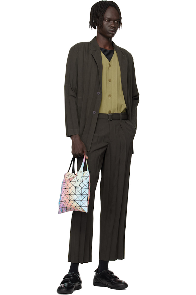 Mesh tote.

· Triangular iridescent vinyl appliqués throughout
· Adjustable shoulder straps
· Zip pocket at interior
· H11" x W11"

Supplier color: White base