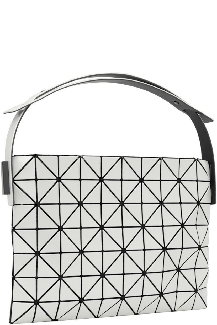 Mesh shoulder bag. 

· Signature triangular vinyl appliqués in white
· Adjustable shoulder strap
· Zip closure
· Logo-woven zip pocket at interior
· Unlined
· Logo-engraved gunmetal-tone hardware
· H7.5" x W11" x D2"

Supplier color: Pearl white