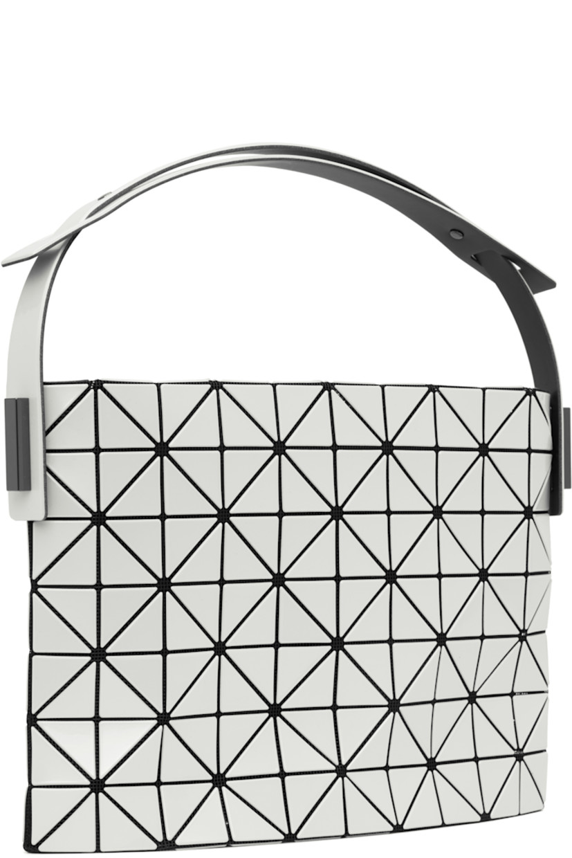 Mesh shoulder bag. 

· Signature triangular vinyl appliqués in white
· Adjustable shoulder strap
· Zip closure
· Logo-woven zip pocket at interior
· Unlined
· Logo-engraved gunmetal-tone hardware
· H7.5" x W11" x D2"

Supplier color: Pearl white