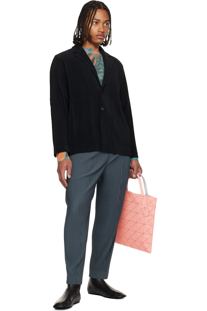 Mesh tote.

· Signature triangular vinyl appliqués throughout
· Adjustable shoulder straps
· Open throat
· Zip pocket at interior
· H13.5" x W13.5"

Supplier color: Light orange/Orange
