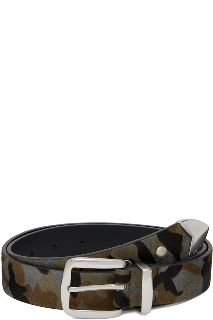 Hair-on leather belt.

· Camouflage pattern printed throughout
· Stud, crystal-cut accent, and hardware at end
· Pin-buckle fastening
· W1.25"

Supplier color: Multi