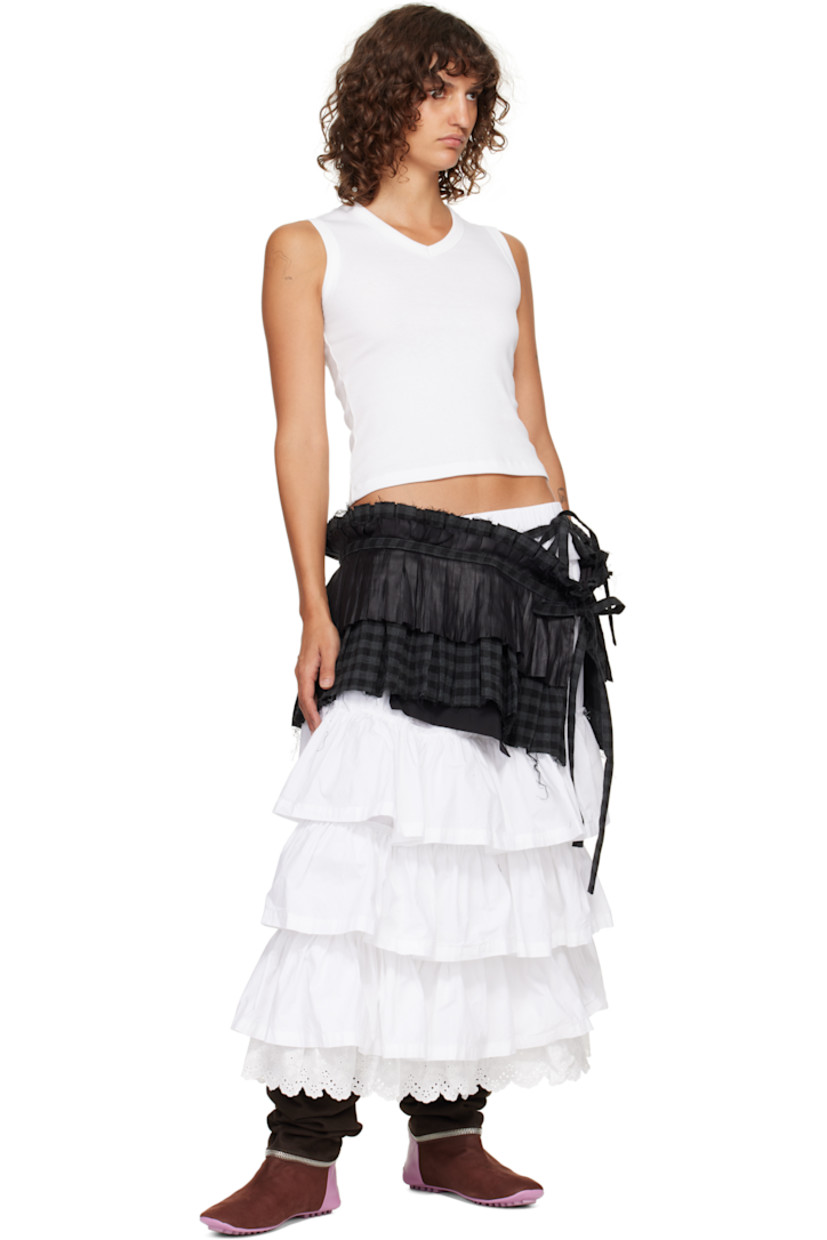 Cotton flannel and satin belt. 

· Check pattern, pleats, and frayed edges throughout 
· Two zip pockets at front 
· Self-tie fastening 
· W10.5"

Supplier color: Black