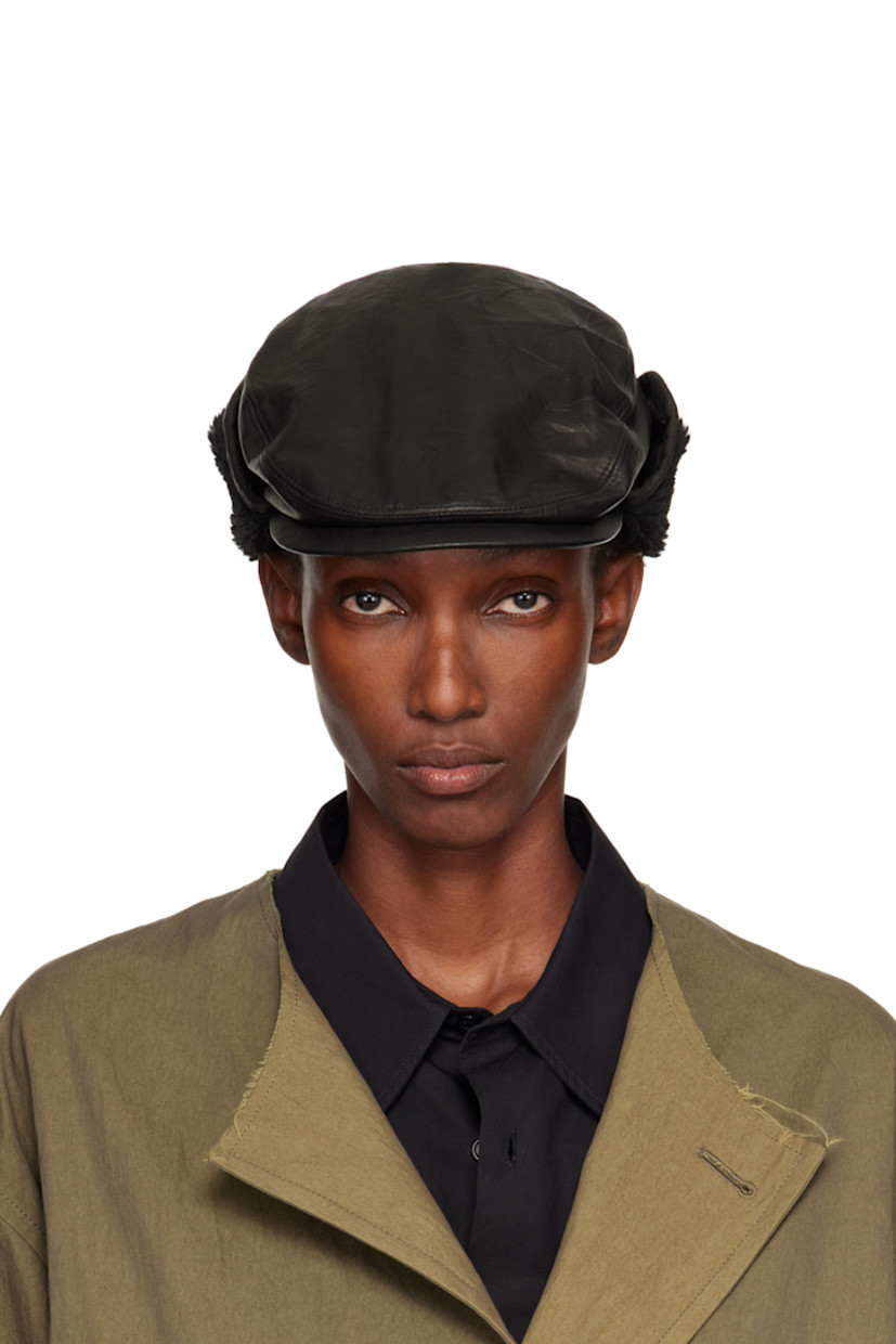 Crinkled leather cap.

· Curved brim
· Sherpa fleece trim at ear flaps
· Grosgrain browband
· Woven lining

Supplier color: Black