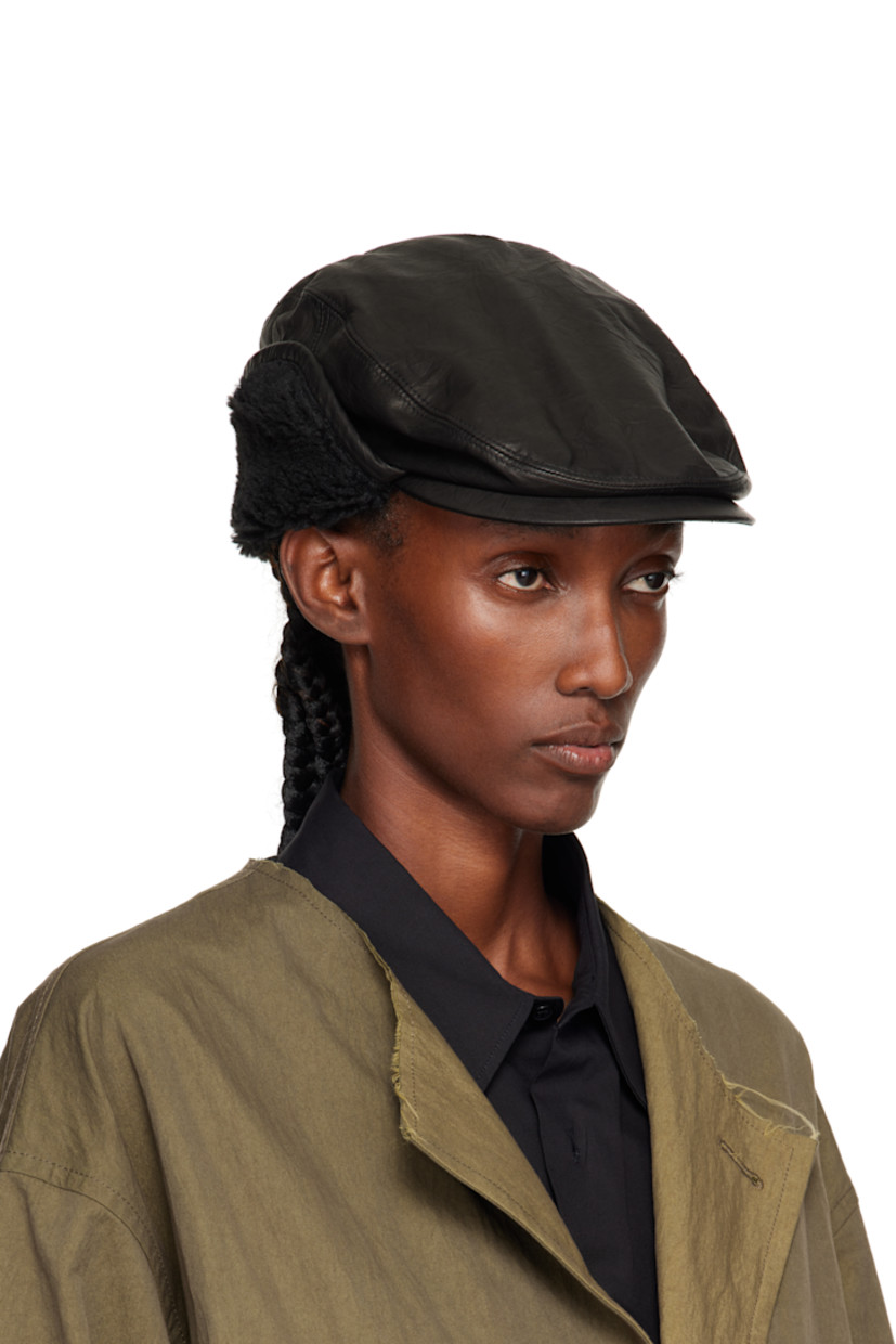 Crinkled leather cap.

· Curved brim
· Sherpa fleece trim at ear flaps
· Grosgrain browband
· Woven lining

Supplier color: Black