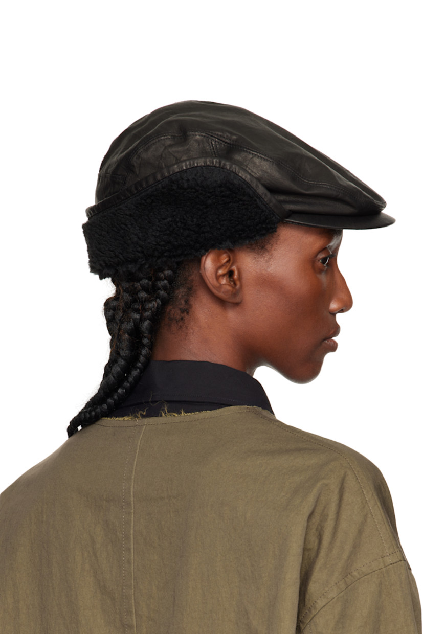 Crinkled leather cap.

· Curved brim
· Sherpa fleece trim at ear flaps
· Grosgrain browband
· Woven lining

Supplier color: Black