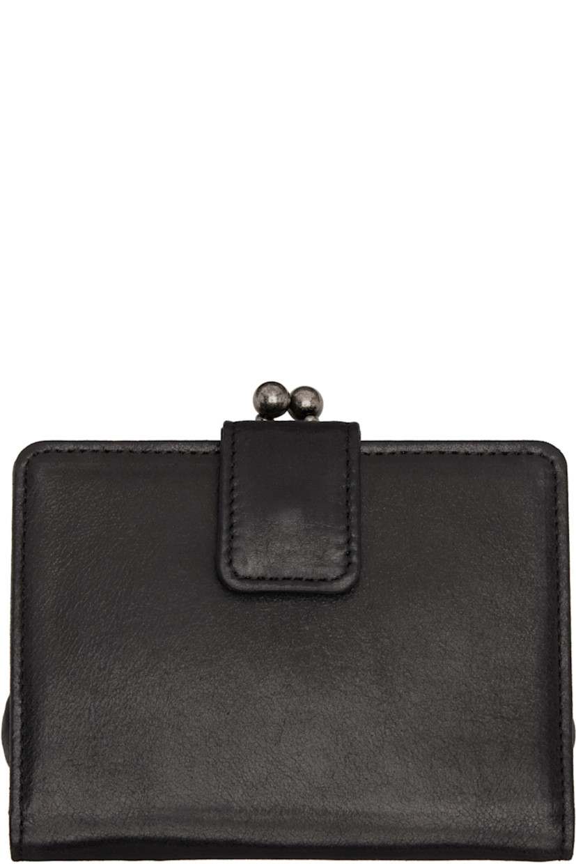 Grained leather bifold wallet. 

· Logo plaque and kiss-lock coin pouch at face
· Press-stud flap closure
· Eight card slots and two patch pockets at interior 
· Curb chain with keyring 
· Silver-tone hardware
· H4.5" x W4.5" x D1"

Supplier color: Black
