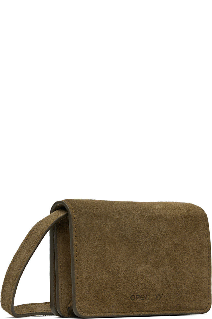 Suede wallet-on-strap bag.

· Adjustable and detachable crossbody strap
· Studded logo with crystals at face
· Embossed logo at back face
· Foldover press-stud flap
· Coin compartment and three card slots
· Canvas lining
· H3" x W4.25" x D1.75"

Supplier color: Khaki brown