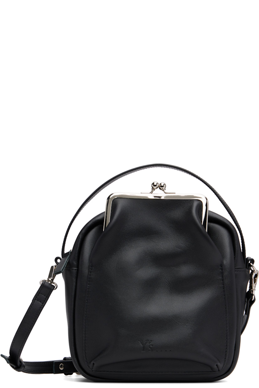 Buffed leather shoulder bag.

· Fixed carry handle
· Adjustable and detachable crossbody strap
· Patch pocket at face and back face
· Logo embossed at face
· Zip closure
· Cotton twill lining
· H7.75" x W7" x D3"

Supplier color: Black