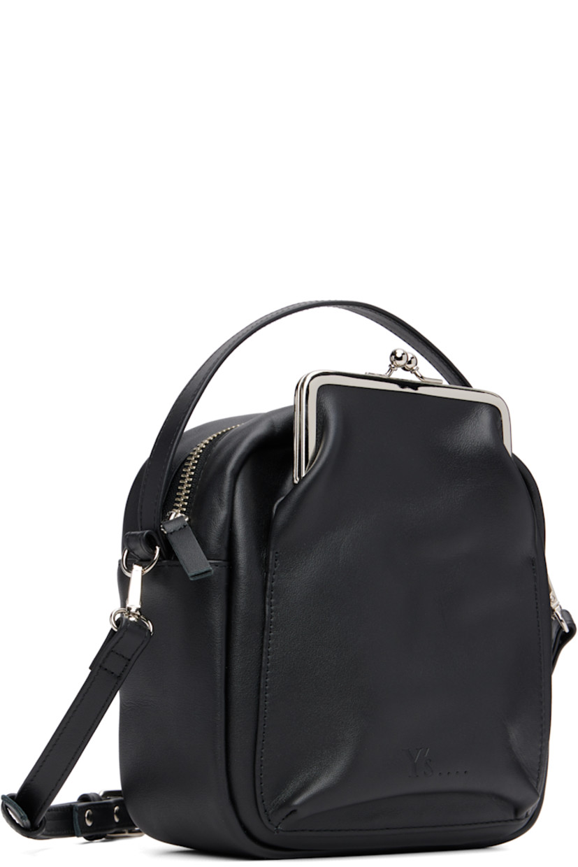 Buffed leather shoulder bag.

· Fixed carry handle
· Adjustable and detachable crossbody strap
· Patch pocket at face and back face
· Logo embossed at face
· Zip closure
· Cotton twill lining
· H7.75" x W7" x D3"

Supplier color: Black