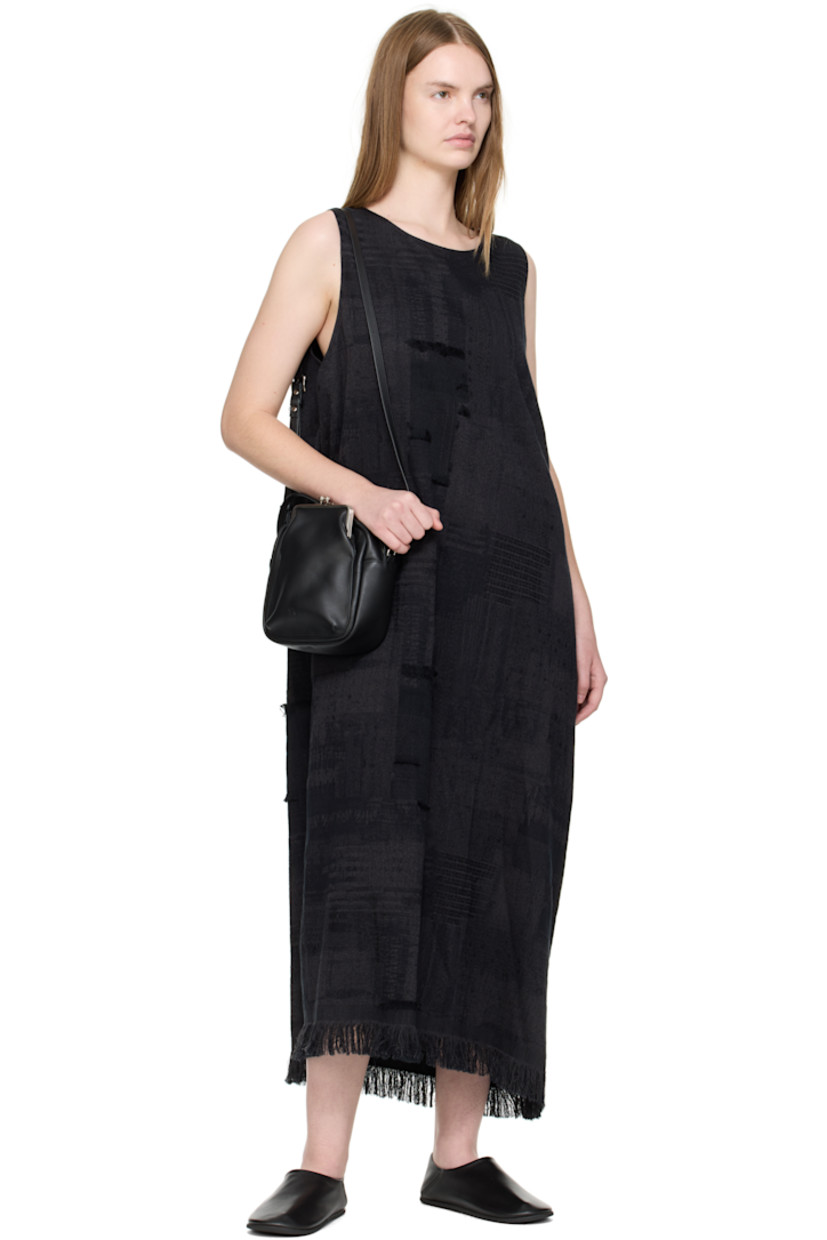 Buffed leather shoulder bag.

· Fixed carry handle
· Adjustable and detachable crossbody strap
· Patch pocket at face and back face
· Logo embossed at face
· Zip closure
· Cotton twill lining
· H7.75" x W7" x D3"

Supplier color: Black