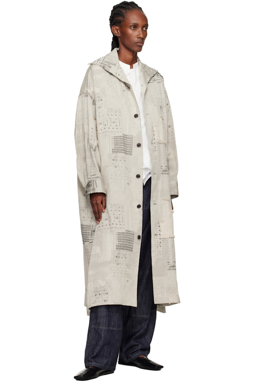 Plain-woven cotton coat.

· Woven pattern with fringed detailing throughout 
· Spread collar 
· Button closure
· Welt pockets at front 
· Vented side seams 
· Dropped shoulders
· Pleats at buttoned barrel cuffs
· Box pleat at back yoke 
· Unlined

Supplier color: Ivory