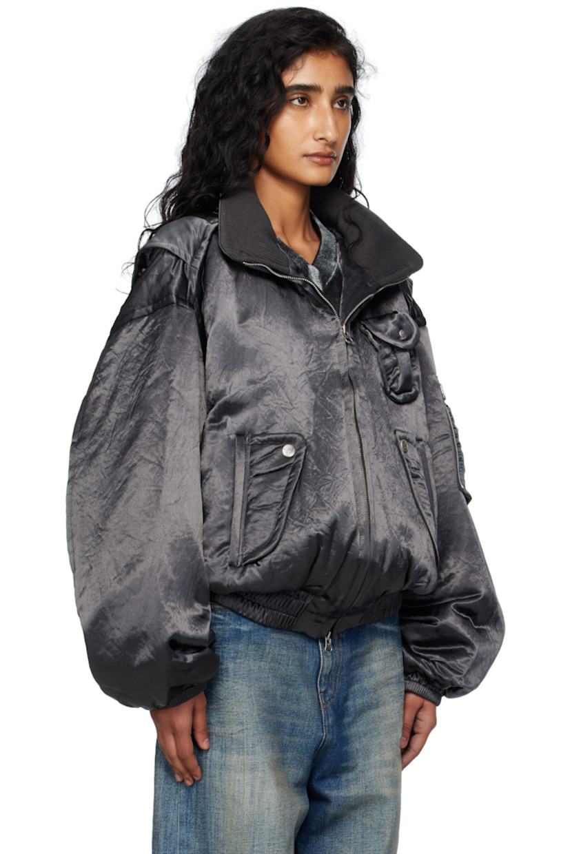Insulated satin bomber jacket. 

· Stand collar
· Two-way zip closure
· Patch pocket at chest
· Flap pockets at waist
· Elasticized hem and cuffs
· Dropped shoulders
· Utility pocket and pen slots at sleeve
· Rib-knit interior collar 
· Welt pocket at interior 
· Twill lining
· Logo-engraved silver-tone hardware 

Supplier color: Charcoal