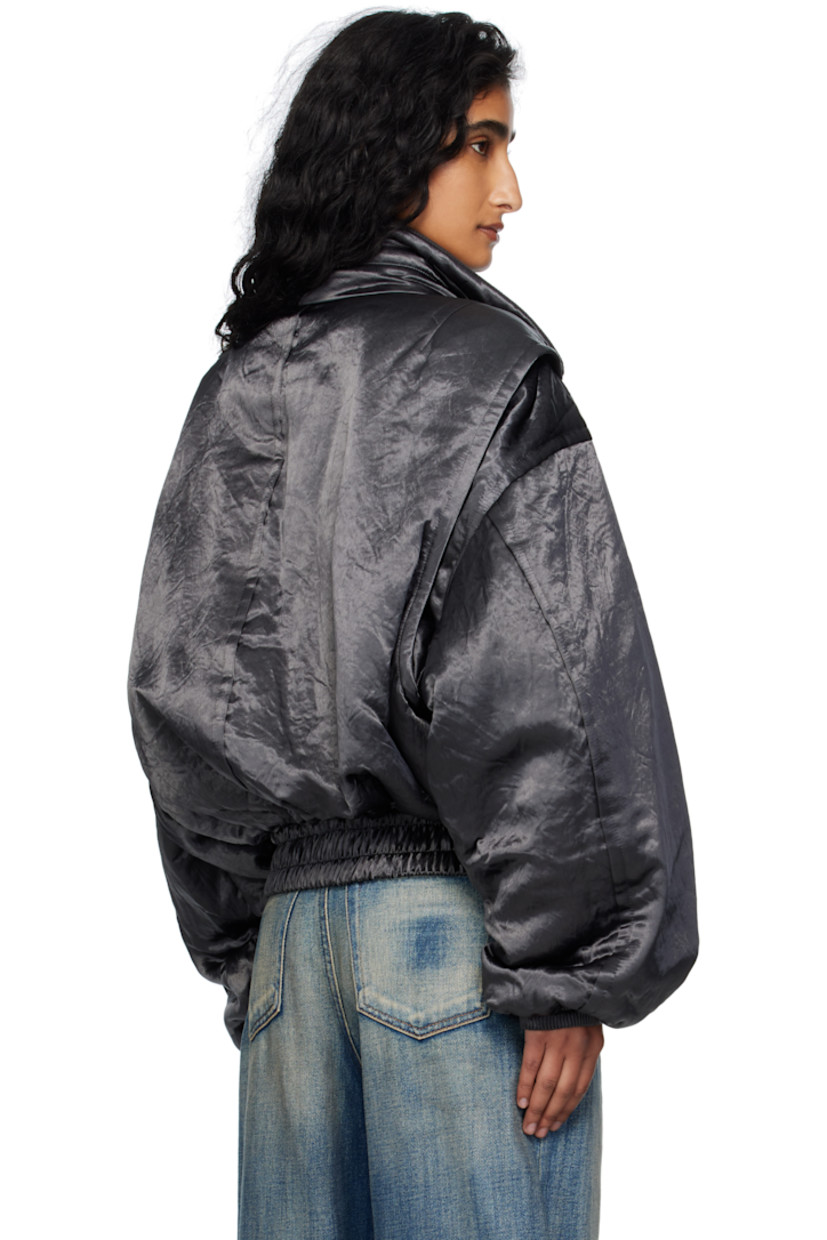 Insulated satin bomber jacket. 

· Stand collar
· Two-way zip closure
· Patch pocket at chest
· Flap pockets at waist
· Elasticized hem and cuffs
· Dropped shoulders
· Utility pocket and pen slots at sleeve
· Rib-knit interior collar 
· Welt pocket at interior 
· Twill lining
· Logo-engraved silver-tone hardware 

Supplier color: Charcoal