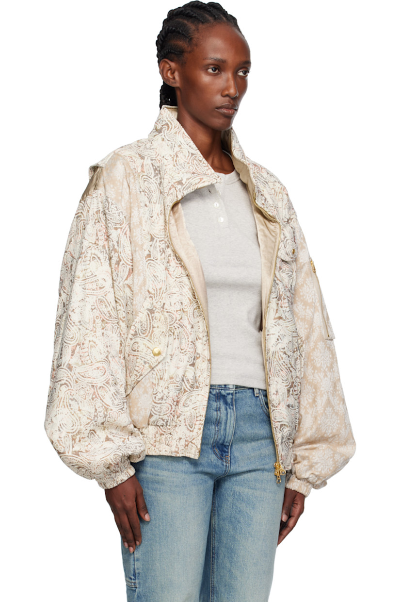 Padded stretch gobelin bomber jacket.

· Stand collar
· Two-way zip closure
· Patch pocket with press-stud flap at chest
· Welt pockets and flap pockets at waist
· Elasticized hem and cuffs
· Utility pocket and embroidered logo at sleeve
· Gusset and satin panel at back shoulders
· Welt pocket at interior
· Full satin lining
· Logo-engraved gold-tone hardware

Supplier color: Beige