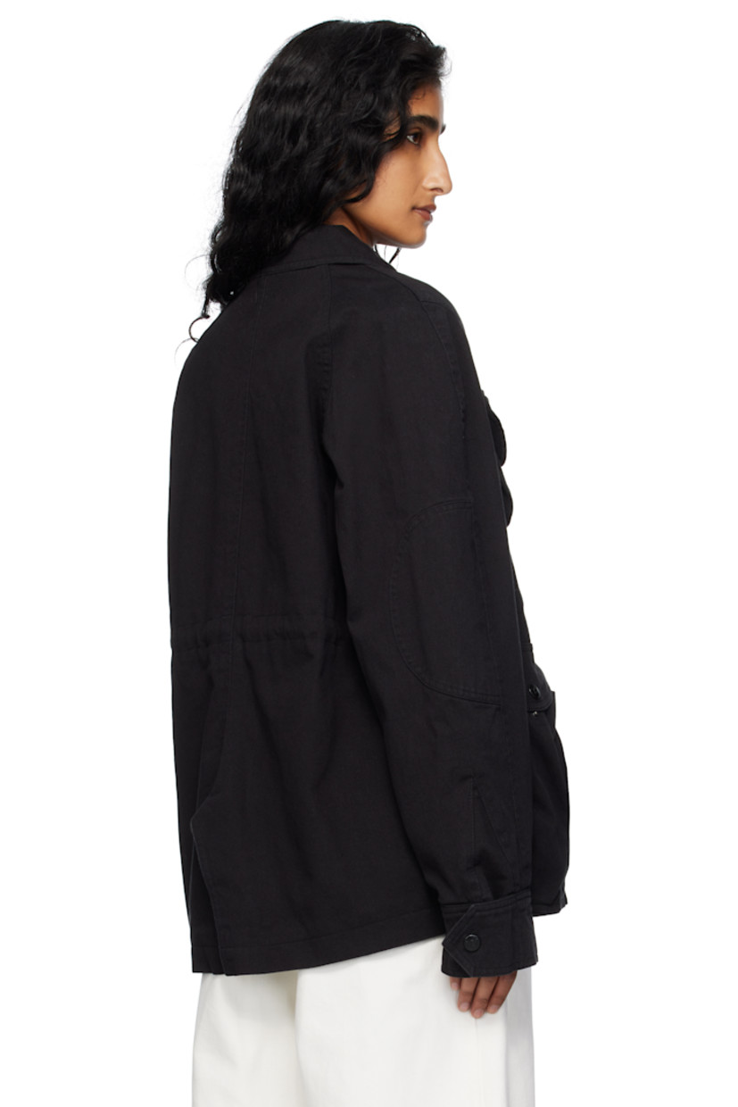Non-stretch denim jacket. 

· Spread collar
· Concealed button closure
· Bellows pockets at front 
· Grommets at armscyes
· Press-stud barrel cuffs
· Raglan sleeves at back
· Central vent at back hem 
· Drawstring at interior waist 
· Full cotton seersucker lining 

Supplier color: Black