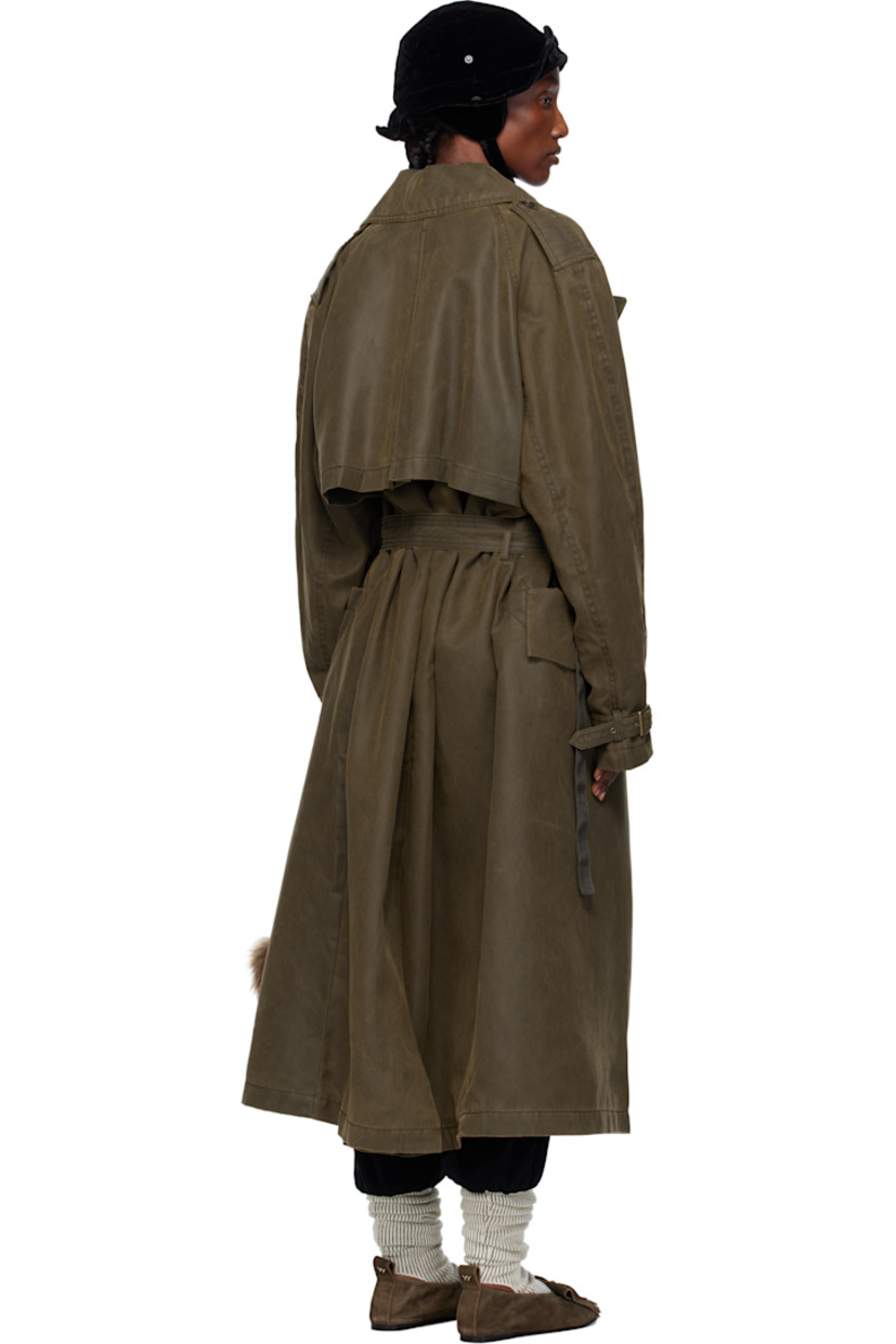 Peached twill trench coat.

· Notched lapel
· Pin-buckle strap at collar
· Concealed press-stud closure
· D-ring at chest
· Patch pocket and flap pockets at front
· Belt loop and integrated pin-buckle belt
· Epaulets
· Dropped shoulders
· Pin-buckle strap at cuffs
· Storm flap with button fastening at back
· Central vent at back hem
· Adjustable button tab at interior waist
· Full satin lining
· Antiqued gold-tone hardware

Supplier color: Khaki