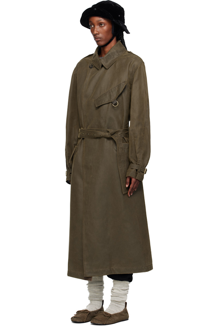 Peached twill trench coat.

· Notched lapel
· Pin-buckle strap at collar
· Concealed press-stud closure
· D-ring at chest
· Patch pocket and flap pockets at front
· Belt loop and integrated pin-buckle belt
· Epaulets
· Dropped shoulders
· Pin-buckle strap at cuffs
· Storm flap with button fastening at back
· Central vent at back hem
· Adjustable button tab at interior waist
· Full satin lining
· Antiqued gold-tone hardware

Supplier color: Khaki
