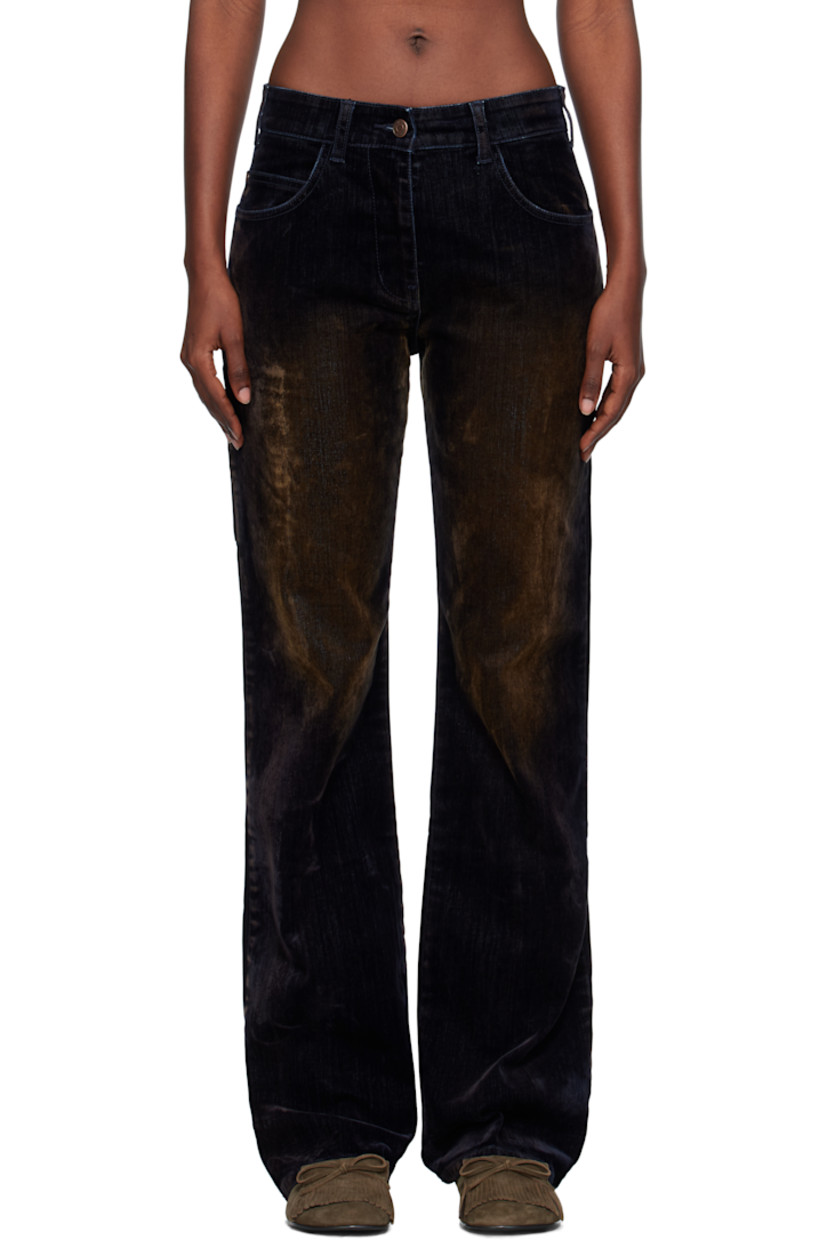 Flocked stretch denim jeans.

· Fading throughout
· Belt loops
· Five-pocket styling
· Zip fly
· Logo patch at back waistband
· Patch pockets at back leg
· Logo-engraved antiqued copper-tone hardware

Supplier color: Black