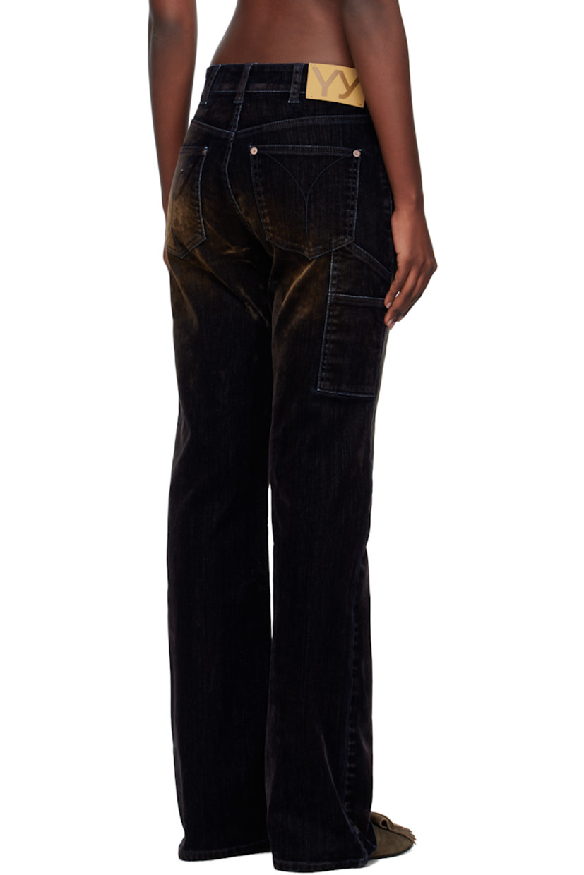 Flocked stretch denim jeans.

· Fading throughout
· Belt loops
· Five-pocket styling
· Zip fly
· Logo patch at back waistband
· Patch pockets at back leg
· Logo-engraved antiqued copper-tone hardware

Supplier color: Black
