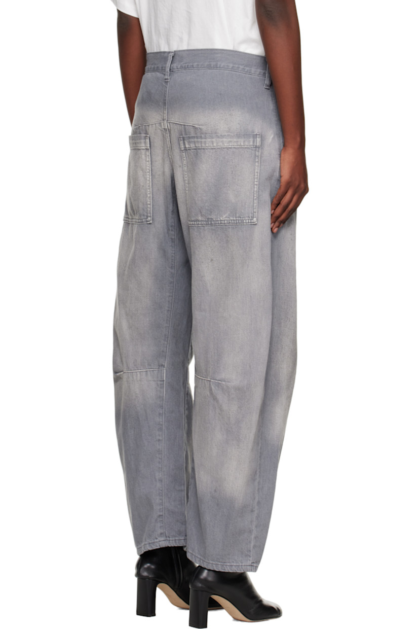 Non-stretch denim jeans.

· Wide-leg 
· Fading and whiskering throughout 
· Belt loops
· Five-pocket styling
· Zip fly 
· Tucks at legs
· Gusset at inseam

Supplier color: Grey