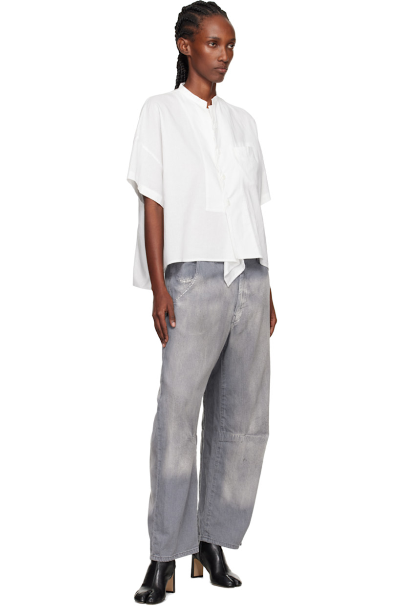 Non-stretch denim jeans.

· Wide-leg 
· Fading and whiskering throughout 
· Belt loops
· Five-pocket styling
· Zip fly 
· Tucks at legs
· Gusset at inseam

Supplier color: Grey