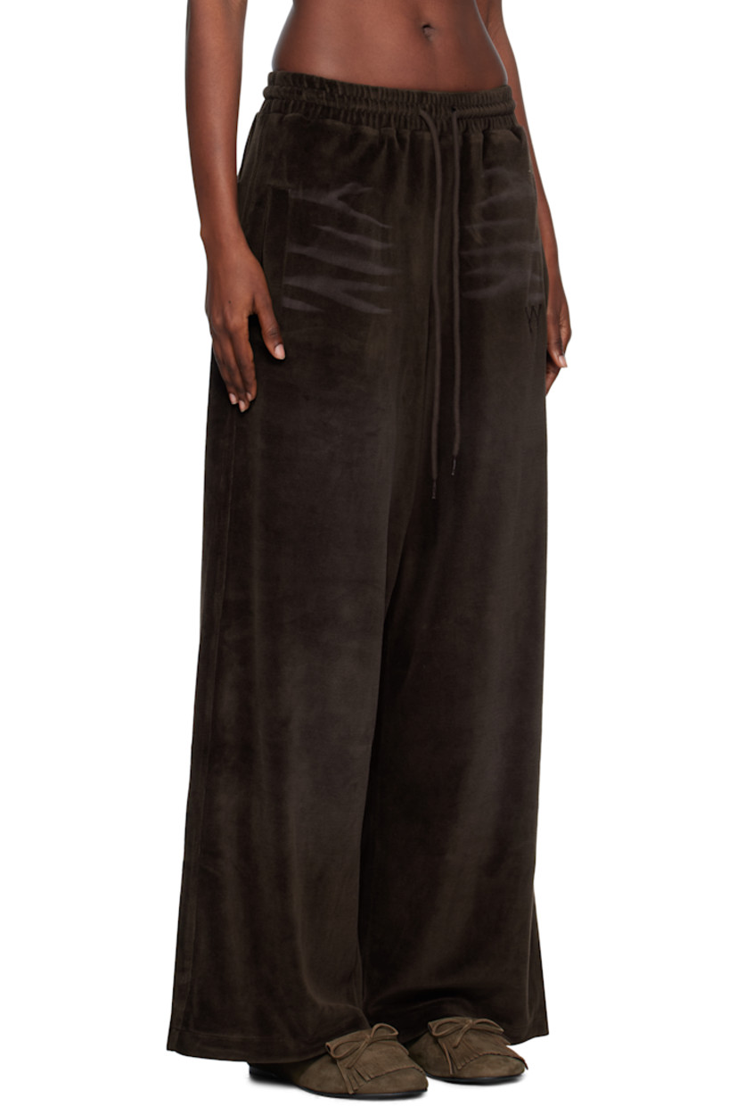 Cotton-blend velour lounge pants.

· Whiskering throughout
· Wide-leg
· Drawstring at elasticized waistband
· Four-pocket styling
· Gathering at waist
· Logo embroidered at front

Supplier color: Brown