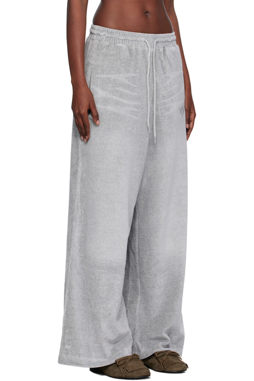 Cotton-blend velour lounge pants.

· Whiskering throughout
· Wide-leg
· Drawstring at elasticized waistband
· Four-pocket styling
· Gathering at waist
· Logo embroidered at front

Supplier color: Gray