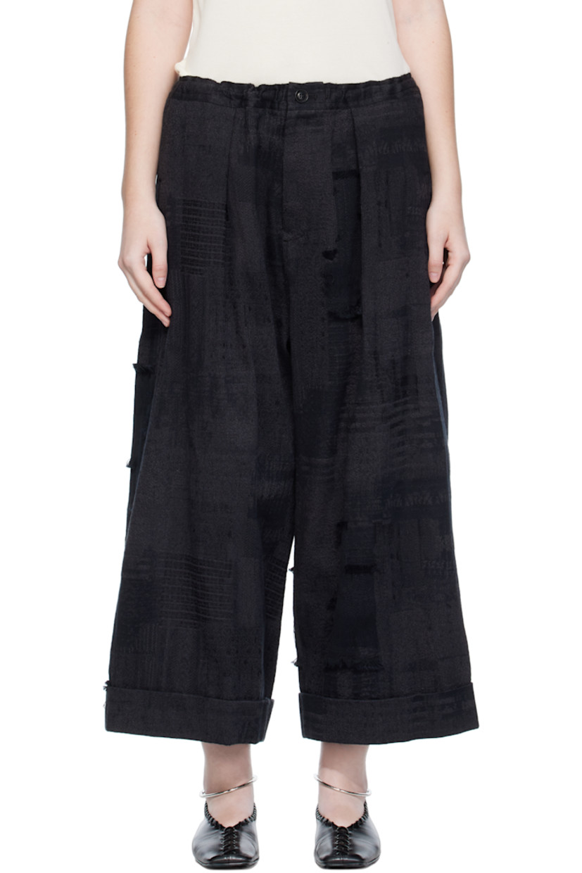 Wide-leg woven cotton trousers.

· Jacquard and fil-coupé pattern throughout
· Concealed drawstring at elasticized waistband
· Three-pocket styling
· Zip fly
· Dropped inseam
· Rolled cuffs

Supplier color: Black