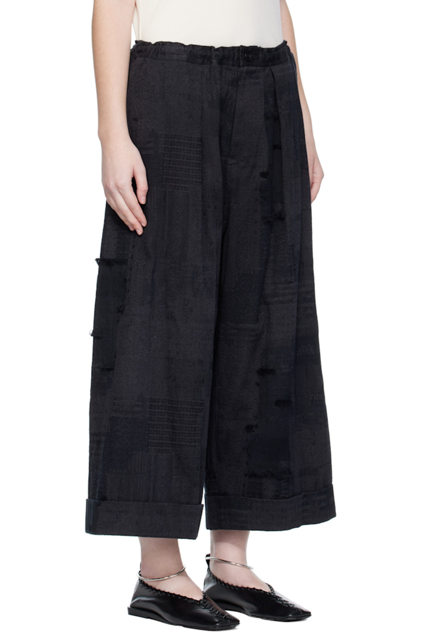 Wide-leg woven cotton trousers.

· Jacquard and fil-coupé pattern throughout
· Concealed drawstring at elasticized waistband
· Three-pocket styling
· Zip fly
· Dropped inseam
· Rolled cuffs

Supplier color: Black