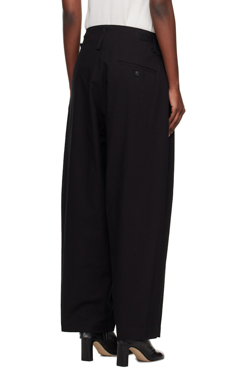 Cotton twill trousers.

· Belt loops
· Cinch tabs at waistband
· Three-pocket styling
· Zip fly 
· Pleats at front 
· Dropped inseam 

Supplier color: Black