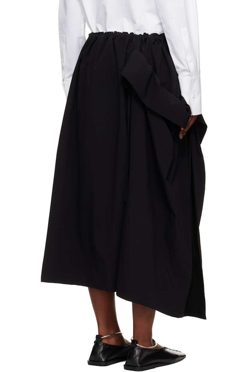 Plain-woven maxi skirt. 

· Concealed drawstring at elasticized waistband
· Single-pocket styling
· Gathering and self-tie panel at side seam

Supplier color: Black