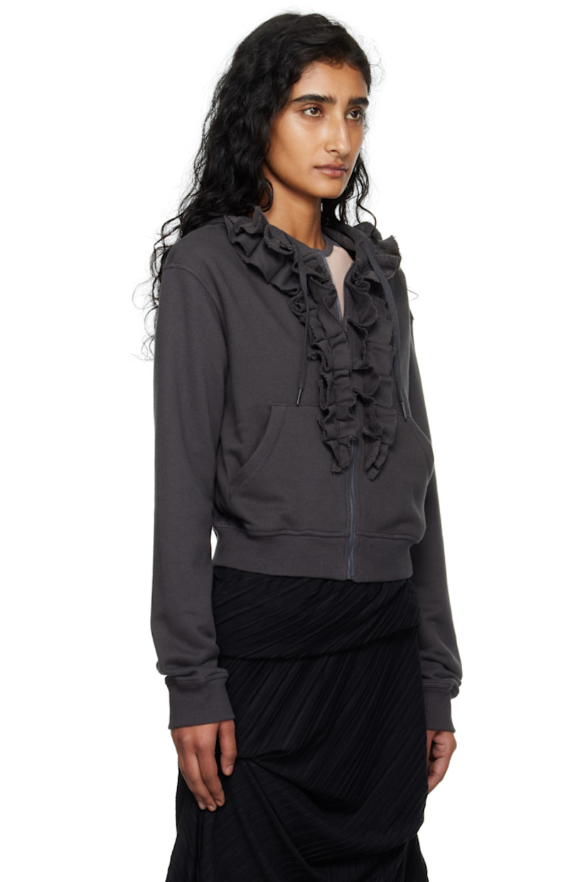 French terry hoodie.

· Drawstring at hood
· Zip closure
· Ruffled trim and patch pockets at front
· Rib-knit hem and cuffs

Supplier color: Charcoal