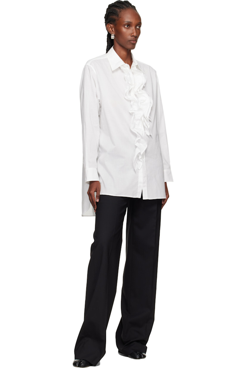 Cotton gauze shirt. 

· Spread collar 
· Ruffled appliqué at button closure 
· Droptail hem 
· Dropped shoulders
· Pleats at buttoned barrel cuffs

Supplier color: Off white