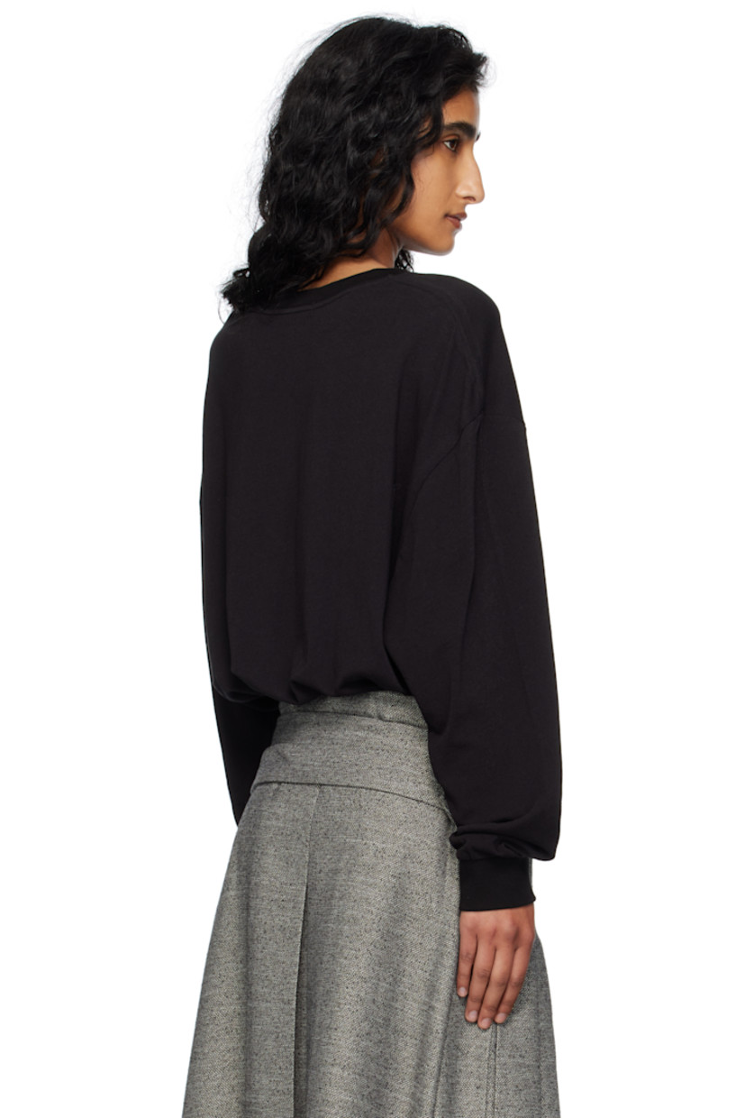 Cotton jersey T-shirt. 

· Rib-knit crewneck and cuffs
· Logo graphic printed at front 
· Dropped shoulders

Supplier color: Black
