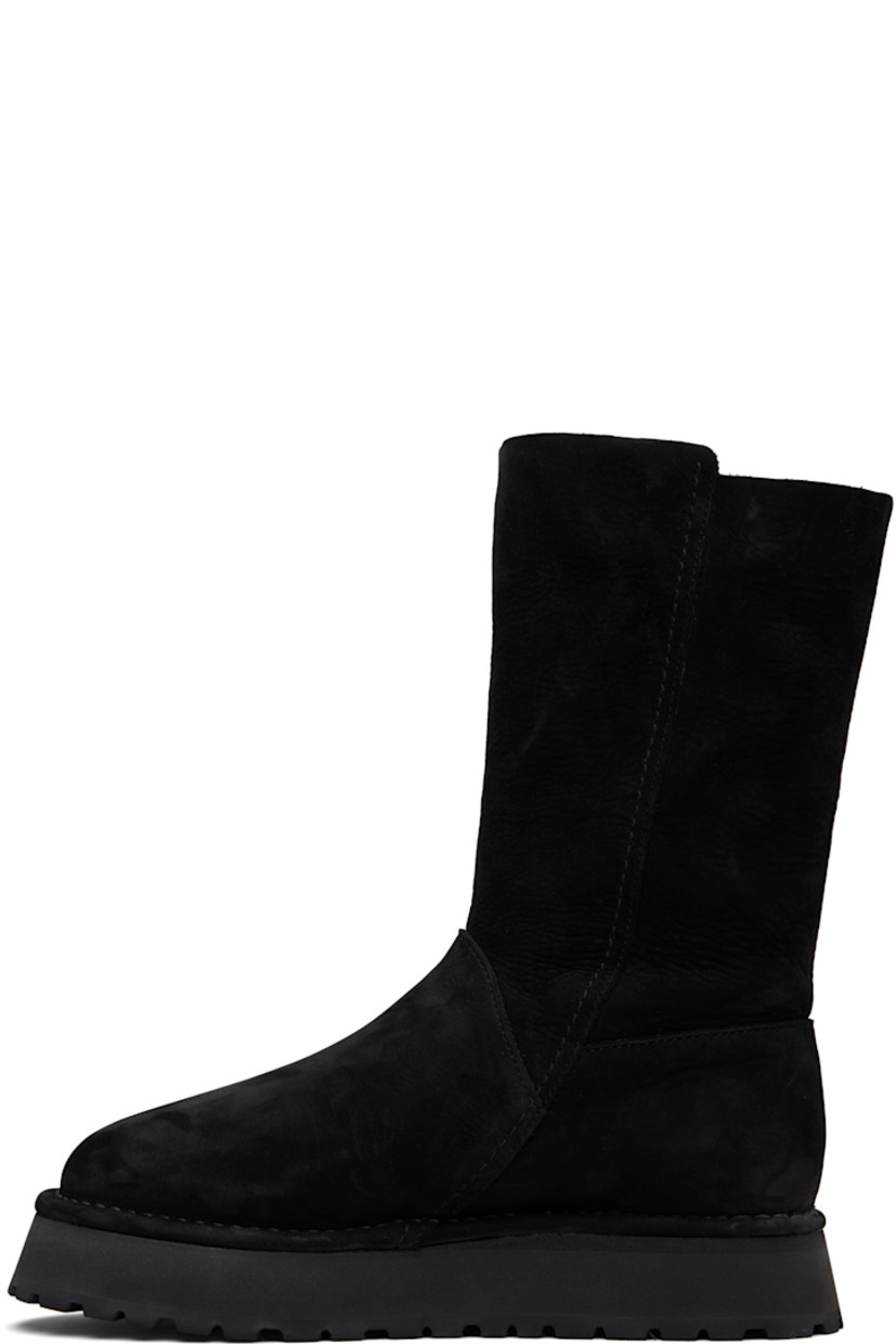 Mid-calf nubuck boots.

· Suede lining
· Topstitching at welt
· Foam rubber midsole
· Treaded rubber sole

Supplier color: Black