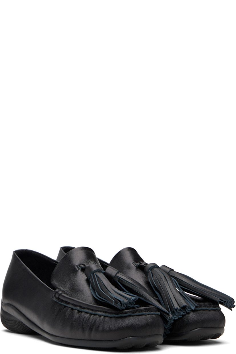 Buffed leather loafers.

· Square moc toe
· Tassels at vamp
· Treaded rubber sole

Supplier color: Black