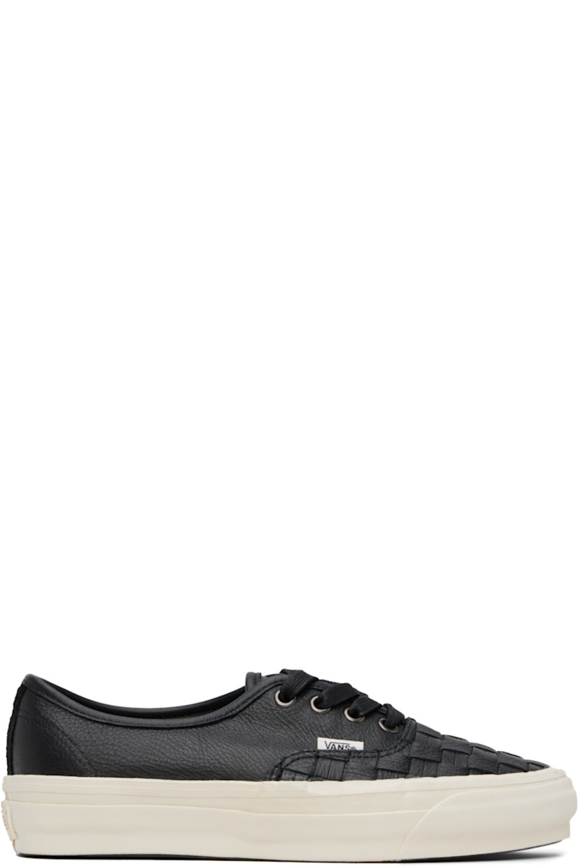 Low-top grained leather sneakers in black. 

· Basket-woven detailing at vamp
· Lace-up closure 
· Logo flag at outer side
· Suede trim at heel 
· Rubberized logo patch at heel midsole
· Treaded rubber sole

Supplier color: Palermo black