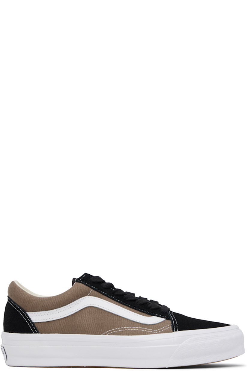 Low-top 8 oz canvas and suede sneakers in black and taupe. 

· Lace-up closure
· Padded collar
· Padded tongue and collar
· Grained leather Sidestripe™
· Padded Sola ADC foam footbed 
· Rubberized logo patch at heel midsole
· Treaded rubber sole
· Contrast stitching in white

Supplier color: Santorini walnut grey/Black
