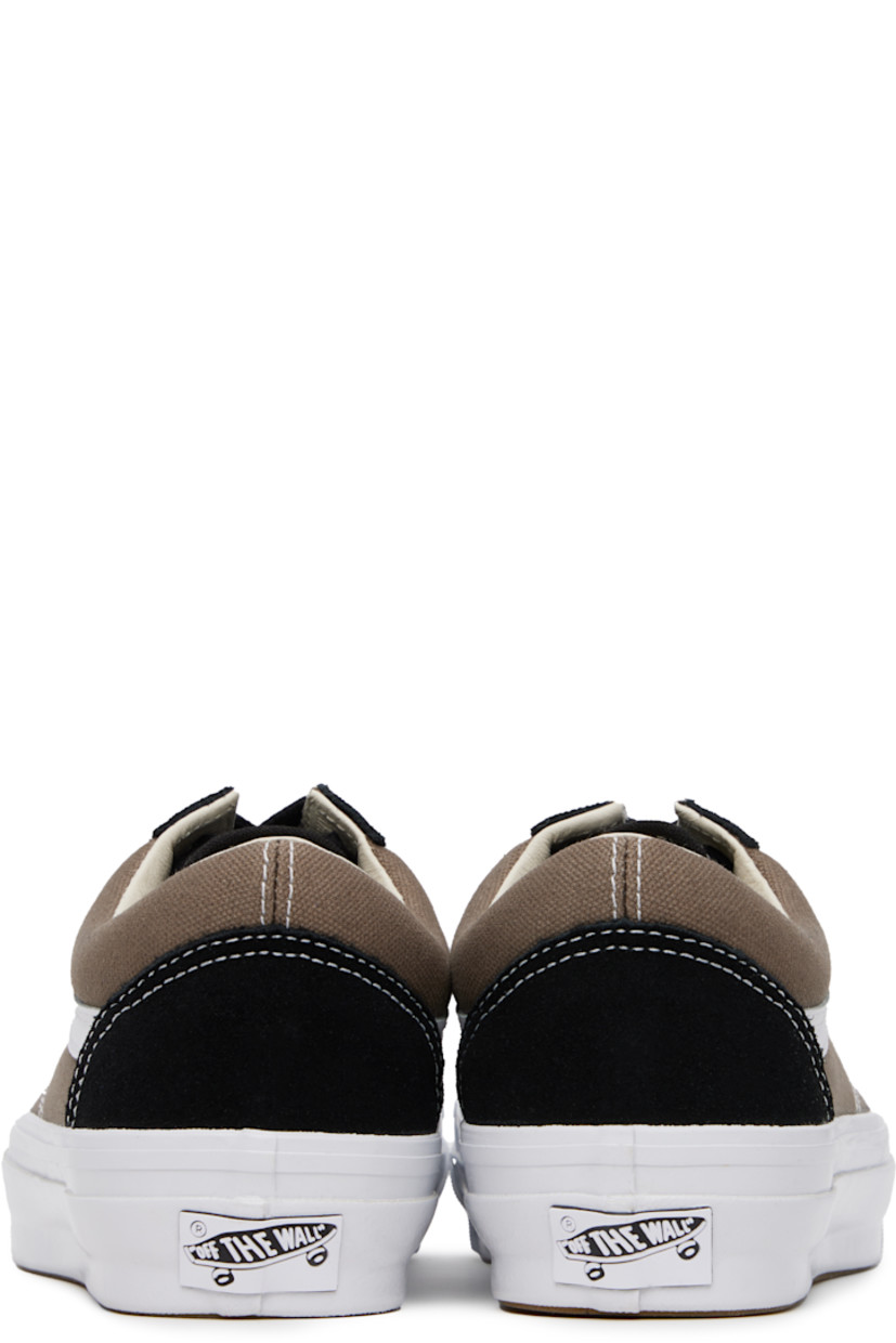 Low-top 8 oz canvas and suede sneakers in black and taupe. 

· Lace-up closure
· Padded collar
· Padded tongue and collar
· Grained leather Sidestripe™
· Padded Sola ADC foam footbed 
· Rubberized logo patch at heel midsole
· Treaded rubber sole
· Contrast stitching in white

Supplier color: Santorini walnut grey/Black