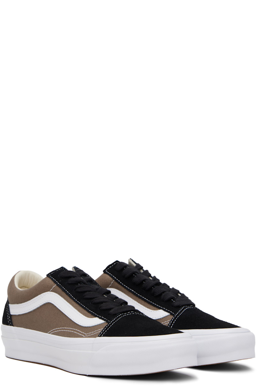 Low-top 8 oz canvas and suede sneakers in black and taupe. 

· Lace-up closure
· Padded collar
· Padded tongue and collar
· Grained leather Sidestripe™
· Padded Sola ADC foam footbed 
· Rubberized logo patch at heel midsole
· Treaded rubber sole
· Contrast stitching in white

Supplier color: Santorini walnut grey/Black