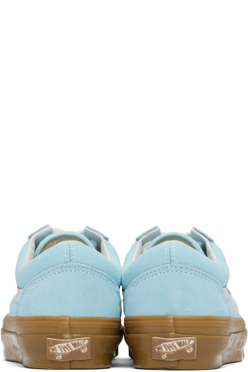 Low-top paneled suede and 8 oz canvas sneakers in blue. 

· Lace-up closure
· Padded collar 
· Grained leather Sidestripe™ at sides
· Rubberized logo patch at heel
· Removable padded Sola ADC foam footbed
· Textured rubber midsole
· Treaded rubber sole
· Contrast stitching in white 

Supplier color: Crystal blue/Gum