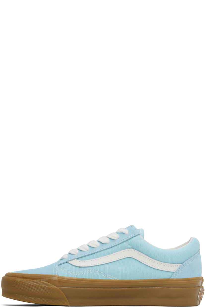 Low-top paneled suede and 8 oz canvas sneakers in blue. 

· Lace-up closure
· Padded collar 
· Grained leather Sidestripe™ at sides
· Rubberized logo patch at heel
· Removable padded Sola ADC foam footbed
· Textured rubber midsole
· Treaded rubber sole
· Contrast stitching in white 

Supplier color: Crystal blue/Gum