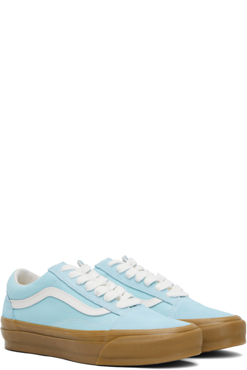 Low-top paneled suede and 8 oz canvas sneakers in blue. 

· Lace-up closure
· Padded collar 
· Grained leather Sidestripe™ at sides
· Rubberized logo patch at heel
· Removable padded Sola ADC foam footbed
· Textured rubber midsole
· Treaded rubber sole
· Contrast stitching in white 

Supplier color: Crystal blue/Gum