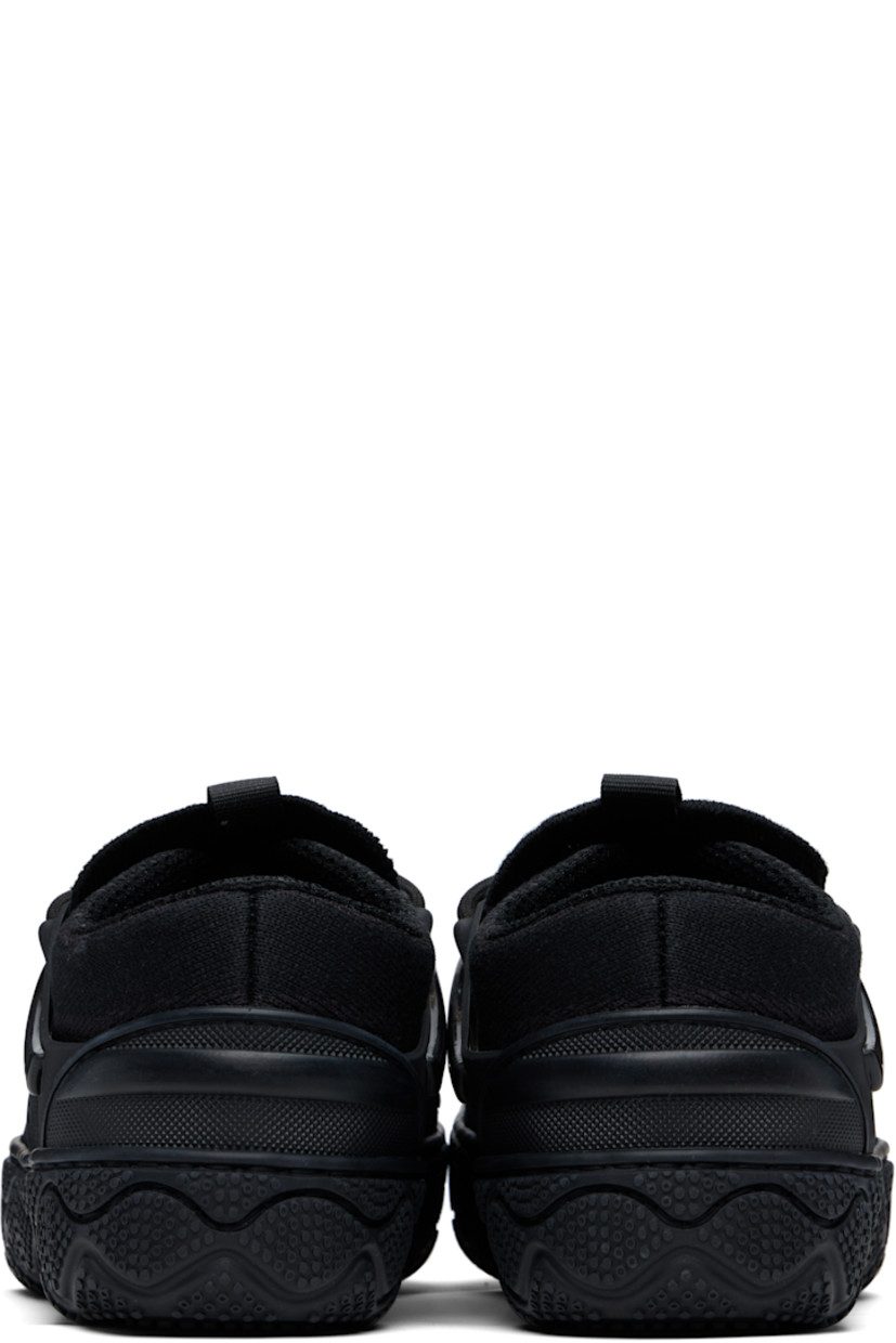 Low-top knit sneakers in black.

· Perforations throughout
· Textured rubber cap toe and heel counter
· Lace-up closure
· Pull-loop at tongue
· Padded collar
· Rubber overlay at sides
· Cushioned Sola Foam ADC insole
· Mesh lining
· Textured rubber midsole
· Treaded rubber sole

Supplier color: Black