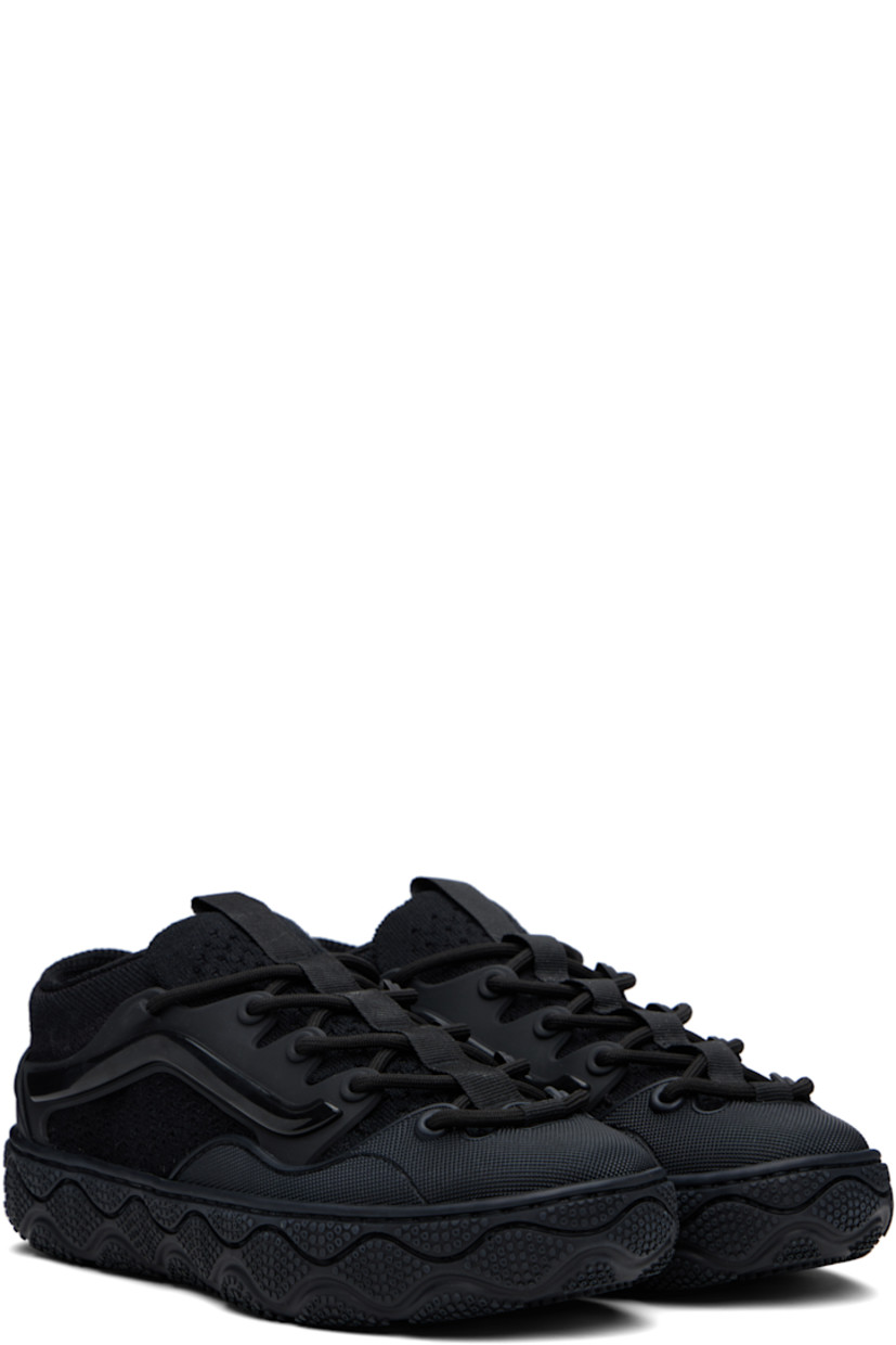 Low-top knit sneakers in black.

· Perforations throughout
· Textured rubber cap toe and heel counter
· Lace-up closure
· Pull-loop at tongue
· Padded collar
· Rubber overlay at sides
· Cushioned Sola Foam ADC insole
· Mesh lining
· Textured rubber midsole
· Treaded rubber sole

Supplier color: Black