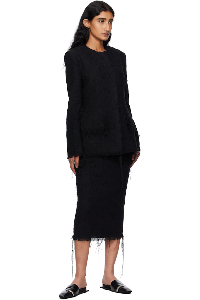 Wool-blend tweed blazer. 

· Frayed edges throughout 
· Round neck
· Press-stud closure
· Mock flap pockets
· Full plain-woven lining 

Supplier color: Black
