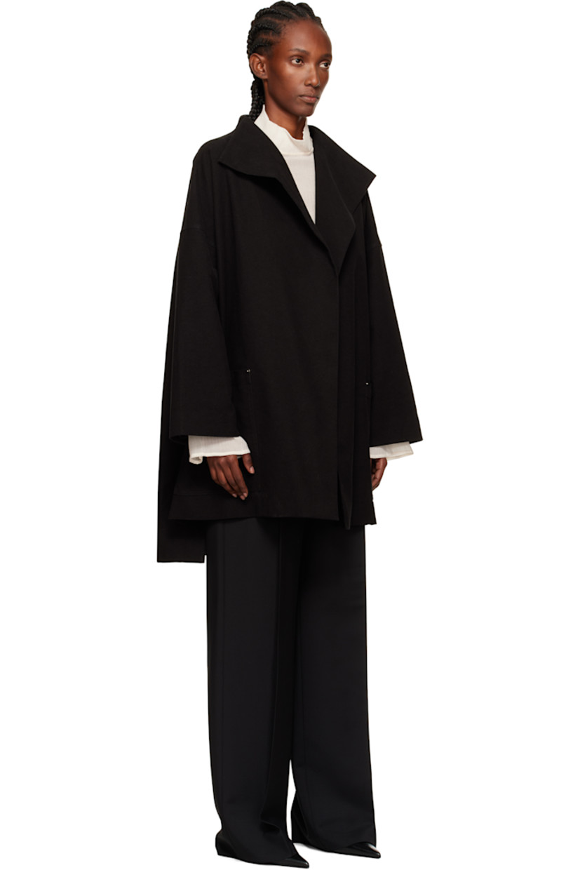 Stretch cotton moleskin coat.

· Shawl lapel
· Open front
· Patch pockets at waist
· Droptail hem
· Vented side seams
· Dropped shoulders
· Full satin lining

Supplier color: Black