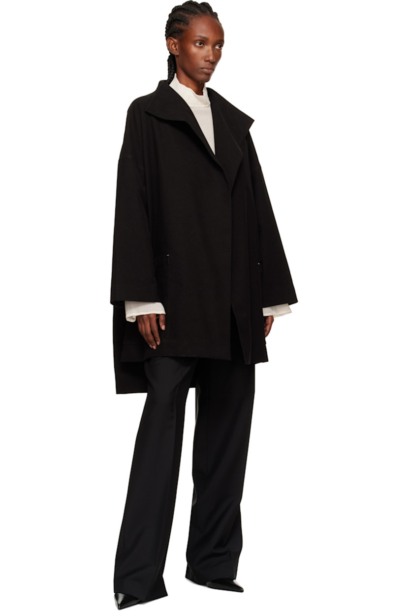 Stretch cotton moleskin coat.

· Shawl lapel
· Open front
· Patch pockets at waist
· Droptail hem
· Vented side seams
· Dropped shoulders
· Full satin lining

Supplier color: Black