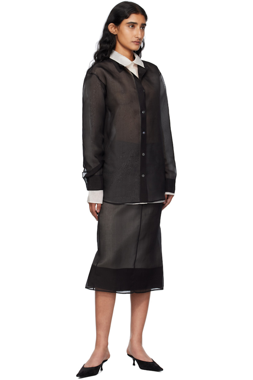 Sheer silk organza shirt. 

· Layered construction 
· Spread collar 
· Button closure 
· Pleat at buttoned barrel cuffs
· Full silk twill lining

Supplier color: Black/Cream